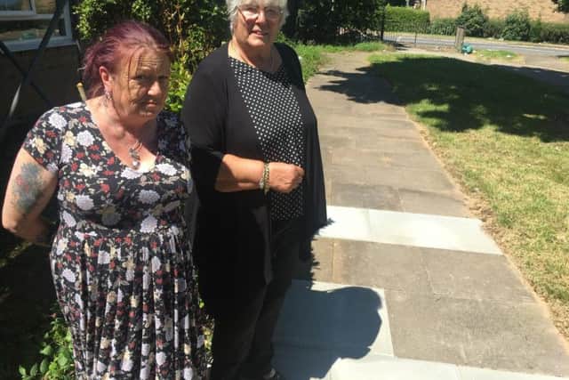 Debbie Tompkins (left) and Dianne Finnie by the newly-fixed path between Tonmead Road and Mounts Court