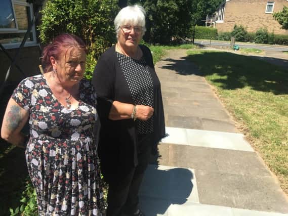 Debbie Tompkins (left) and Dianne Finnie by the newly-fixed path between Tonmead Road and Mounts Court