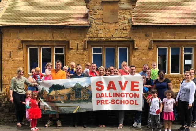 Parents and children pictured outside Dallington Pre-school back in June last year.
