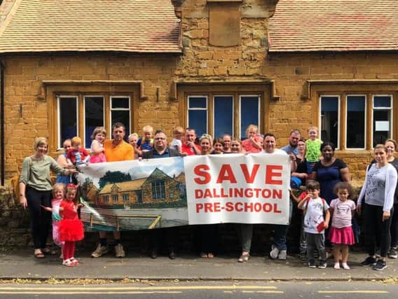 Parents and children pictured outside Dallington Pre-school back in June last year.