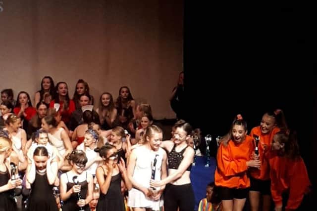 Team Acrocirque collect their trophy. Photo: Zoiey Smale
