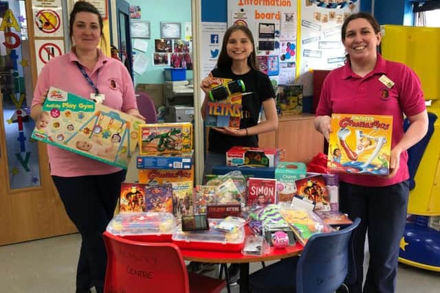 Brilliant Ellie pictured here with the gifts she appealed for. Picture credit: Insight Magazine.