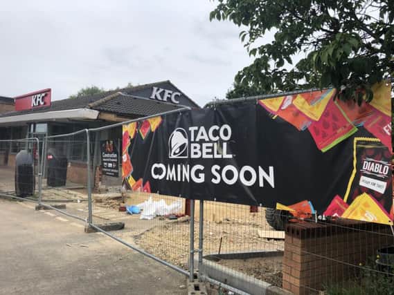 'Coming soon' signs have now gone up on the fencing surrounding the new Taco Bell.