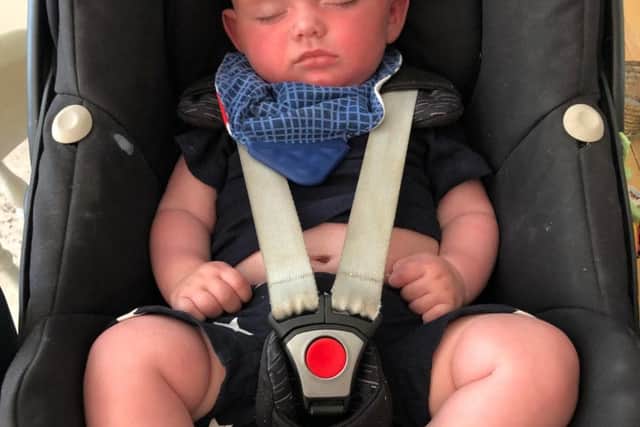 Thankfully four-month-old Tommy slept through the ordeal.