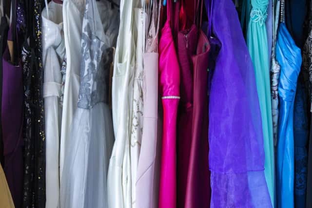 Vicky's spare room has been transformed into a dazzling dressing room filled with prom, red carpet, and wedding dresses, and suits.