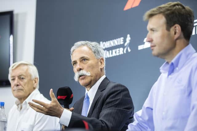 F1 chairman Chase Carey talks at the press conference announcing Silverstone retaining the British Grand Prix to 2024, alongside Silverstone managing director Stuart Pringle (right), and British Racing Drivers' Club (BRDC) chairman John Grant. Photo: Kirsty Edmonds