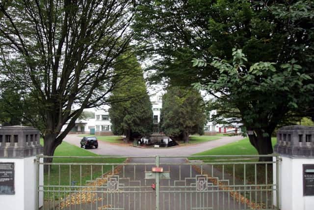 Outside the gates of the Pearce Leatherworks front entrance. Archive photo.