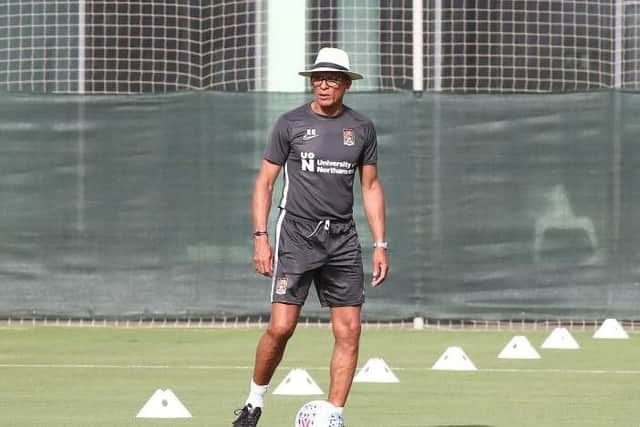 Cobblers boss Keith Curle... and that hat