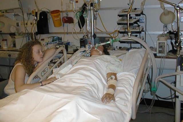 Hayley pictured waiting by Natasha's bedside after her heart and lung transplant in 2001.
