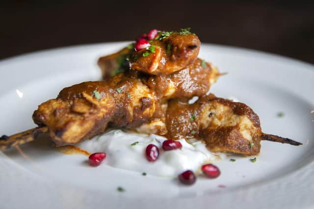Massaman chicken skewers with pomegranate and coconut tzatziki dip.