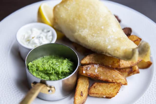 Freshly beer-battered line-caught cod and chips with twice-cooked chunky chips and minted pea puree.