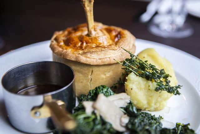 Buttermilk chicken, Somerset brie and bacon pie with creamed potato, cavolo nero, pan-fried oyster mushrooms and jus.