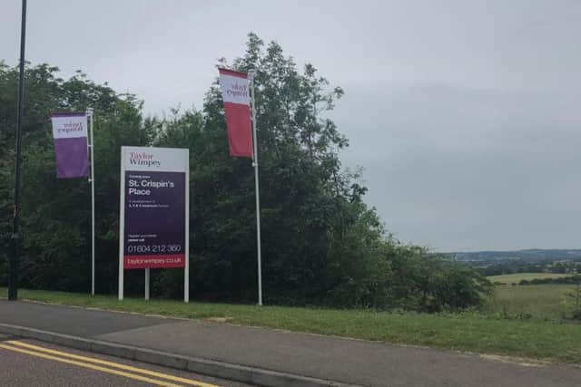 A sign for the "St Crispin's Place" development has gone up in Duston.