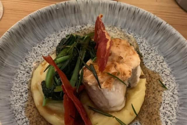 Pan seared monkfish tail wrapped in serrano ham, truffle pomme puree, wilted spinach, red wine jus