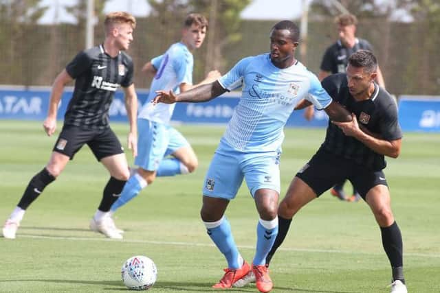 Joe Martin challenges for the ball in the Cobblers' clash with Coventry City (Pictures: Pete Norton)