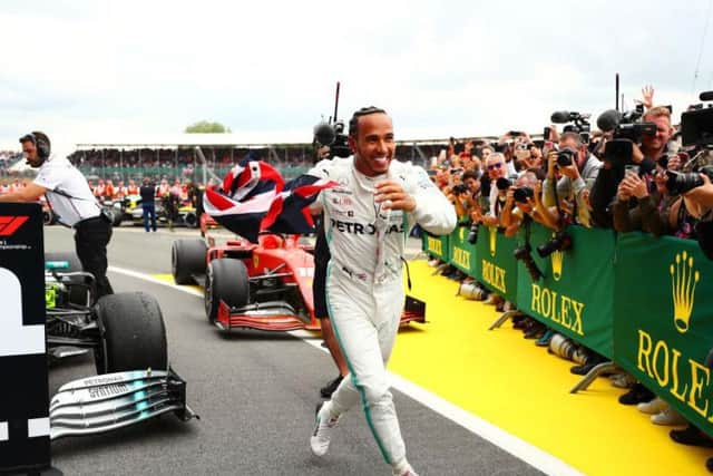 Lewis Hamilton is all smiles after his victory