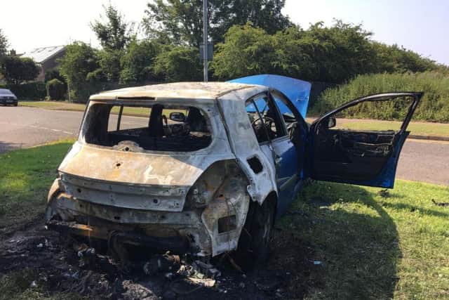 The burnt-out Renault Megane was torched and dumped in a Northampton neighbourhood.
