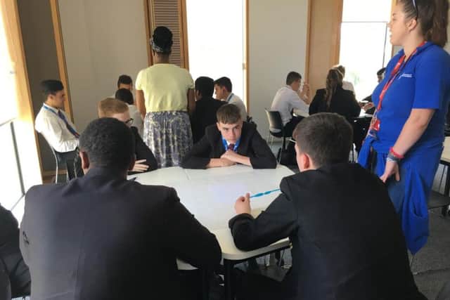 Pupils think about what to turn their straw into