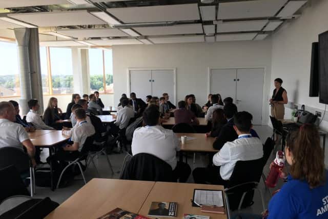 The pupils are welcomed to the university before speaking to the business leaders