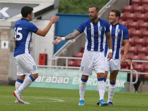 Steven Fletcher celebrates firing Sheffield Wednesday into a 2-0 lead against the Cobblers (Pictures: Pete Norton)