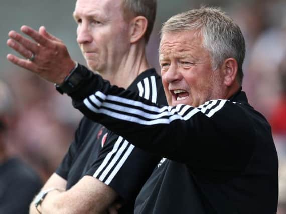 Chris Wilder and Alan Knill watch their Sheffield United team beat the Cobblers 2-0 on Saturday (Picture: Pete Norton)