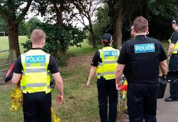 Police at the scene in Pennycress Place and the A5076 Great Billing Way