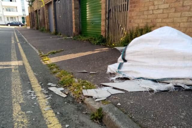 Councillor Enam Haque says he is "very upset" that the potentially hazardous sheets have not been cleared away.