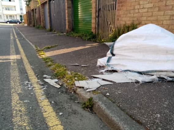 Councillor Enam Haque says he is "very upset" that the potentially hazardous sheets have not been cleared away.