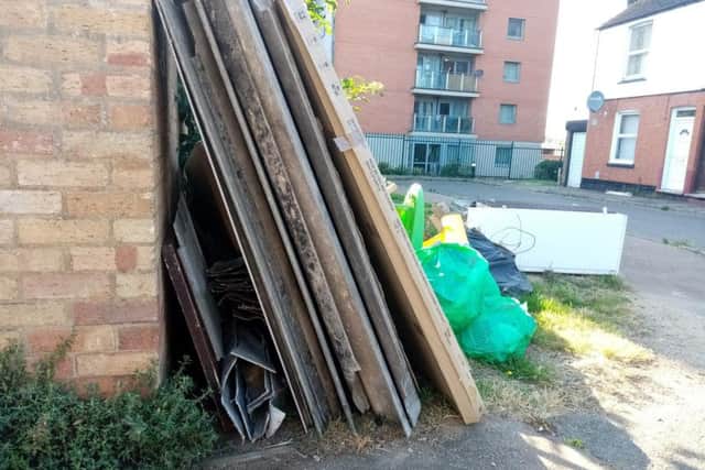 Dozens of the corrugated sheets are lying in Tower Street.