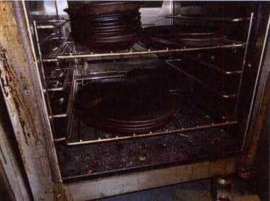 Pictures taken by the environmental health inspector shows the dirty oven.