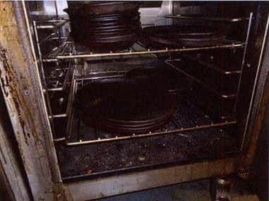 Pictures taken by the environmental health inspector shows the dirty oven.