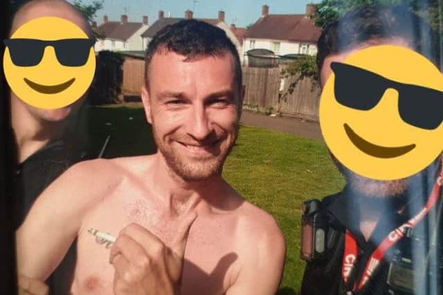 Andrew Fox in handcuffs after being arrested by police in Kettering, who hid their faces behind emojis. Photo: Northamptonshire Police/Twitter