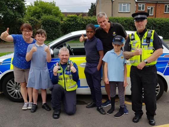 Staff and pupils from Fairfields School with police officers after their visit. Photo: Northamptonshire Police