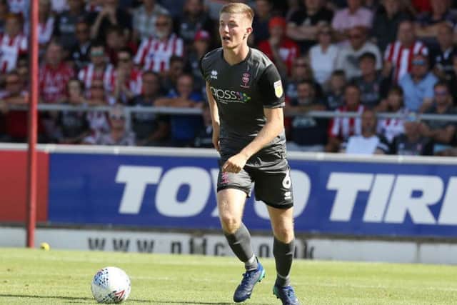 Scott Wharton spent the first half of last season on loan at Lincoln City, playing in their 1-0 opening day win at the Cobblers (Picture: Pete Norton)