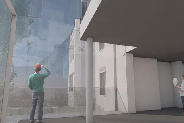 The new frameless glass conservatory means visitors will be able to look back on the house's iconic design in all weather.