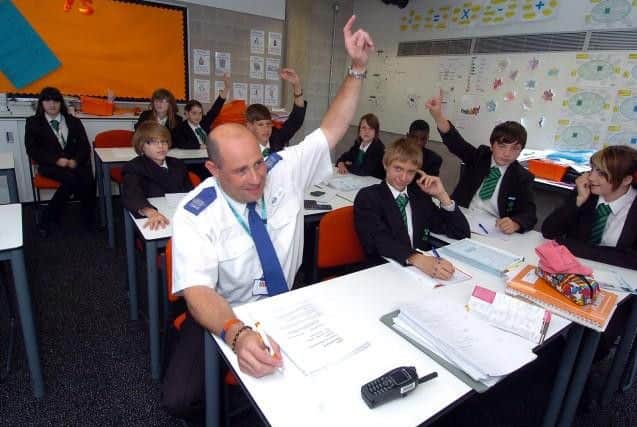 This picture from 2011 shows Mr Franklin taking an exam alongside the pupils of Corby Business Academy.
