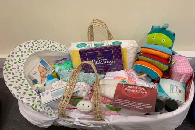 The charity - which started in Grange Park - lovingly makes up each Moses basket.