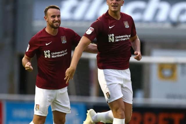 Harry Smith celebrates his goal in Friday night's pre-season friendly win over Milton Keynes Dons (Picture: Pete Norton)