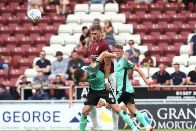 Harry Smith tussles with Mat Sadler. Picture: Pete Norton
