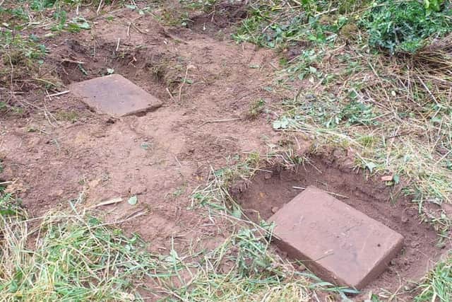 How the deeper headstones looked after being dug up. Photo: Hayley Potts