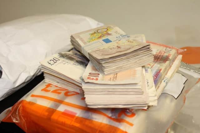 Money that the Butchers' hid in a bathroom safe