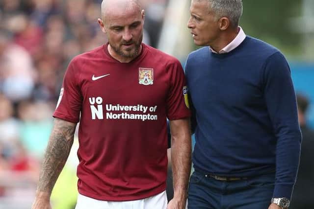 Alan McCormack and Cobblers boss Keith Curle