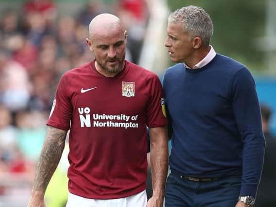 Alan McCormack and Cobblers boss Keith Curle