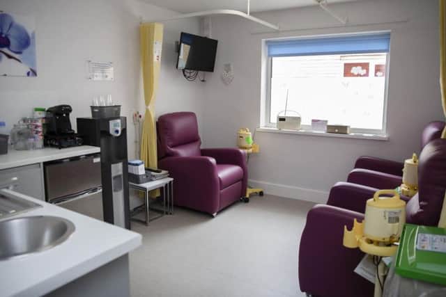 Now the room is bright and airy with comfortable chairs, new privacy curtains and a shiny new kitchen.
