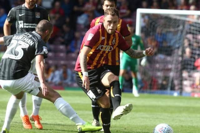 Michael Harriman up against Bradford's Harry Pritchard. Picture: Pete Norton