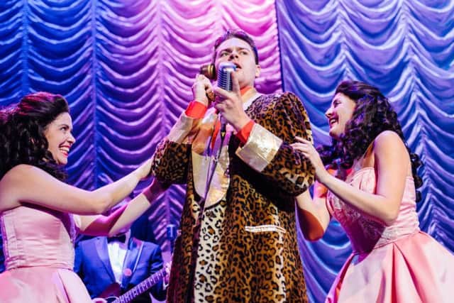 A previous cast performing Buddy - The Buddy Holly Story