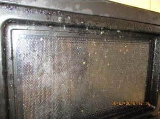 The inside of the microwave was found to be dirty at the time of the inspection.