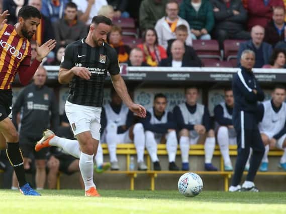 Keith Curle watches on as Matty Warburton makes a break during last Saturday's defeat at Bradford City