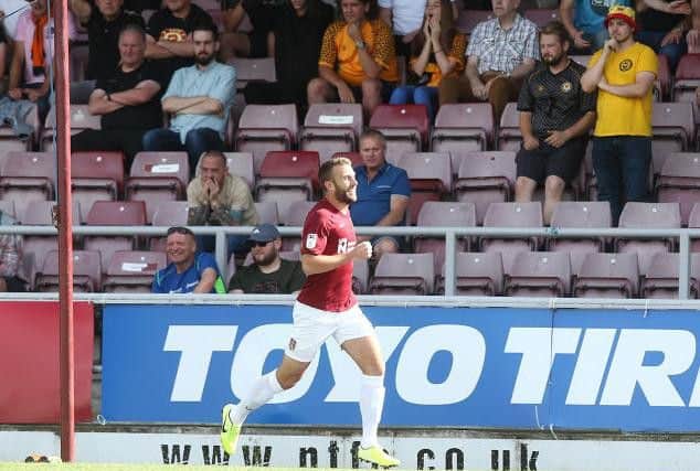 Andy Williams celebrates opening the scoring for the Cobblers in their 2-0 win over Newport County (Pictures: Pete Norton)