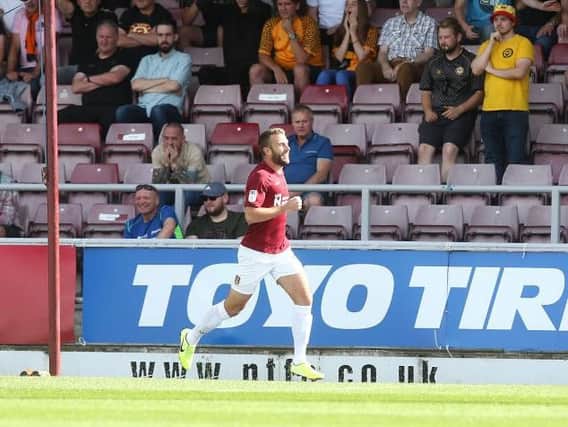Andy Williams celebrates opening the scoring for the Cobblers in their 2-0 win over Newport County (Pictures: Pete Norton)